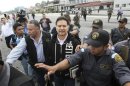 Former Guatemalan president Portillo is escorted before boarding plane for his extradition to United States for money laundering, in Guatemala City