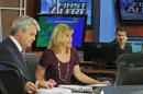 WDBJ-TV7 meteorologist Leo Hirsbrunner, right, wipes his eyes during the early morning newscast as anchors Kimberly McBroom, center, and guest anchor Steve Grant deliver the news at the station in Roanoke, Va., Thursday, Aug. 27, 2015. Reporter Alison Parker and cameraman Adam Ward were killed during a live broadcast Wednesday, while on assignment in Moneta. (AP Photo/Steve Helber)