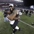In this file photo taken Jan. 20, 2013, Baltimore Ravens inside linebacker Ray Lewis, right, celebrates with Vonta Leach after the NFL football AFC Championship football game against the New England Patriots in Foxborough, Mass. The Ravens are scheduled to face the San Francisco 49ers in Super Bowl XLVII in New Orleans on Sunday, Feb. 3. Leach's job is to get involved in a collision so  Rice won't. (AP Photo/Matt Slocum, file)