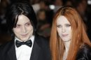 FILE - In this Oct. 29, 2008 file photo, musician Jack White, left, and Karen Elson arrive on the red carpet for the Royal World Premiere of the 22nd James Bond film, "Quantum of Solace" in London. White denies making any threats against his estranged wife, who got a temporary restraining order against him in their contentious divorce case. British singer and model Karen Elson filed for divorce from White last year and recently got a temporary restraining order against him, which is pending an upcoming court hearing. (AP Photo/Joel Ryan, file)
