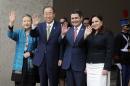 Secretary General of the United Nations Ban Ki-moon, second from left, waves to the press accompanied by his wife, Yoo Soon-taek, left, as they stand with Honduras' President Juan Orlando Hernandez and first lady Ana Garcia Carias, at the presidential office in Tegucigalpa, Honduras, Wednesday, Jan. 14, 2015. Ban Ki-moon began a two-day fact-finding mission in Honduras on efforts to reduce violence in the world's deadliest country and travels next to neighboring El Salvador, where he will attend the 23rd anniversary of peace accords that ended that nation's civil war. (AP Photo/Fernando Antonio)