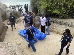 Thai officers walk near the bodies of two British tourists&nbsp;&hellip;