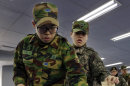 South Korean soldiers cast their absentee votes for the presidential election at a local polling station in Seoul, South Korea, Thursday, Dec. 13, 2012. South Korea's presidential election is scheduled for Dec. 19. (AP Photo/Lee Jin-man)