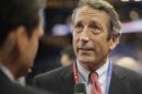FILE - In this Aug. 28, 2012 file photo, former South Carolina Gov. Mark Sanford talks to a reporter in the floor at the Republican National Convention in Tampa, Fla. Nearly four years after his affair with an Argentine woman was exposed, Sanford plans to announce his return to politics and run for his old congressional seat on Wednesday, Jan. 16, 2013. (AP Photo/Charles Dharapak, File)