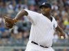 New York Yankees CC Sabathia throws pitches to Toronto Blue Jays in MLB game in New York
