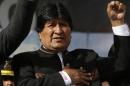 Bolivia's President Evo Morales sings his national anthem at a signing ceremony for the expansion of a road that connects the capital with the nearby city of El Alto, in La Paz, Bolivia, Monday, Feb. 22, 2016, one day after a referendum on expanding presidential term limits. Partial results Monday and unofficial "quick counts" indicated Morales' bid to extend his presidency by amending the constitution appeared headed toward defeat. (AP Photo/Juan Karita)