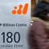 A pedestrian walks past the head offices of BHP Billiton in central Melbourne