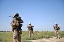 US Marines from Kilo Company of the 3rd Battalion 8th Marines Regiment conduct a patrol in Garmser, Helmand Province on June 29, 2012