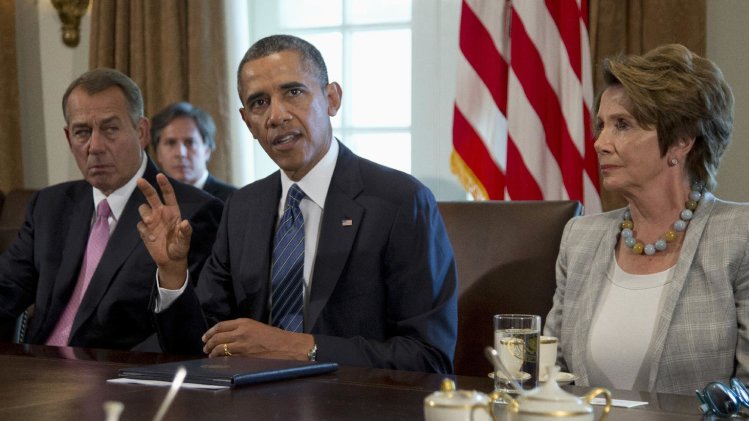 President Barack Obama, flanked by House Speaker John Boehner of Ohio, left, and House Minority Leader Nancy Pelosi of Calif., speaks to media in the Cabinet Room of the White House in Washington, Tuesday, Sept. 3, 2013, before a meeting with members of Congress to discuss the situation in Syria. (AP Photo/Carolyn Kaster)