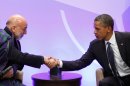 U.S. President Obama shakes hands with Afghanistan President Karzai in Chicago