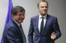 Turkey's Prime Minister Ahmed Davutoglu (L) is welcomed by European Council President Donald Tusk in Brussels on January 15, 2015