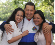 In this photo released by Miraflores Press Office, Venezuela's President <font>Hugo</font> <font>Chavez</font> pose for a picture hugging his daughters <font>Rosa</font> <font>Virginia</font>, left, and Maria Gabriela in a photo taken on Wednesday, March 7, 2012 in Havana, Cuba. The photo was taken before Wednesday meeting with his Colombian counterpart Juan Manuel Santos in Havana, where he's convalescing after undergoing cancer surgery last week. (AP Photo/Miraflores Press Office/Marcelo Garcia)
