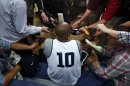United States guard Kobe Bryant (10) talks to reporters during a men's team basketball practice at the 2012 Summer Olympics, Saturday, July 28, 2012, in London. (AP Photo/Jae C. Hong)