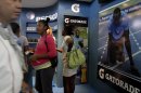 In this picture taken Wednesday Nov. 7, 2012 people visits the Pepsi/Gatorade stand during the 30th Havana International Trade Fair, in Havana, Cuba. Many of America's best-known brands were on display at a Havana exposition center this past week as representatives hawked some of the few U.S. products that can legally be exported to Cuba, thanks to an exception to the U.S. embargo allowing cash-up-front sales of food, agricultural goods and medicine.(AP Photo/Franklin Reyes)