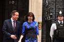 Prime Minister David Cameron, pictured with his wife Samantha, was due to sketch out his new government on Saturday after returning to power in a stunning election victory that toppled his three main rivals