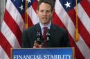 U.S. Treasury Secretary Timothy Geithner announces the Obama administration's revamped TARP financial rescue plan for troubled banks during a speech at the Treasury Department in Washington