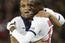 PSG's Blaise Matuidi, right, reacts with PSG's Lucas after scoring the third goal during his French League one soccer match at the Lille Metropole stadium, in Villeneuve d'Ascq, northern France, Saturday, May 10, 2014. Paris Saint-Germain have won their second straight French league title. (AP Photo/Michel Spingler)