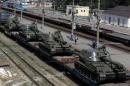 A freight car loaded with self-propelled howitzers is seen at a railway station in Kamensk-Shakhtinsky, Rostov region, near the border with Ukraine