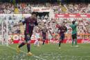 Barcelona's Lionel Messi, celebrates his goal during a Spanish La Liga soccer match between Rayo Vallecano and FC Barcelona at the Vallecas stadium in Madrid, Spain, Saturday, Oct. 4, 2014. (AP Photo/Andres Kudacki)
