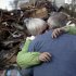 Sheila and Dominic Traina hug in front of their home which was demolished during Superstorm Sandy in Staten Island, N.Y., Friday, Nov. 2, 2012.  Mayor Michael Bloomberg has come under fire for pressing ahead with the New York City Marathon. Some New Yorkers say holding the 26.2-mile race would be insensitive and divert police and other important resources when many are still suffering from Superstorm Sandy. The course runs from the Verrazano-Narrows Bridge on hard-hit Staten Island to Central Park, sending runners through all five boroughs. The course will not be changed, since there was little damage along the route.  (AP Photo/Seth Wenig)