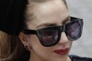 Singer Lady Gaga signs autographs for fans in front of Sheraton Hotel in Asuncion
