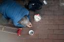 A man begs in front of Shanghai South Railway Station in Shanghai, China, on February 4, 2015