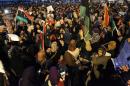 Hundreds of Benghazi residents demonstrate in front of the Tibesti hotel in support of the Libyan Army and Police and against unlawfull militia groups on November 29, 2013 in the eastern city of Benghazi, Libya