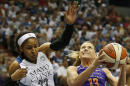Phoenix Mercury forward Penny Taylor (13) tries to push up to the basket against Minnesota Lynx forward Maya Moore (23) during the first half of Game 2 of the WNBA basketball Western Conference finals, Sunday, Aug. 31, 2014, in Minneapolis. (AP Photo/Stacy Bengs)