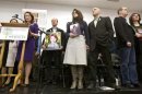 Family members of victims of the December 14, 2012 shooting at Sandy Hook Elementary School are seen on stage during the launch of The Sandy Hook Promise in Newtown