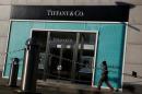 A man walks past a boutique of the luxury jewelry retailer Tiffany & Co. in Beijing