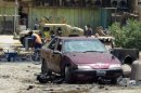 A picture shows the scene following a car bomb in the Shiite bastion of Sadr City, eastern Baghdad, in July 2012