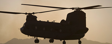 U.S. Marines direct a chinook helicopter arriving to pick up a container with supplies at Forward Operating Base Edi in the Helmand Province of southern Afghanistan, Thursday, June 9, 2011. A chinook helicopter crashed in eastern Afghanistan, killing 31 U.S. special operation troops and seven Afghan commandos. (AP Photo/Anja Niedringhaus)