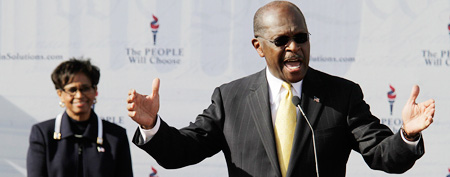 Republican presidential candidate and businessman Herman Cain with his wife Gloria in Atlanta on Saturday. Cain announced the suspension of his campaign. (REUTERS Photo/John Adkisson)