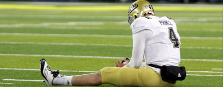 UCLA quarterback Kevin Prince sits on the field after a rough sack during the second half of their NCAA Pac-12 Championship game against Oregon in Eugene, Ore., Friday, Dec. 2, 2011. UCLA lost to Oregon 49-31(AP Photo/Don Ryan)
