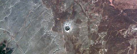 The Barringer meteorite crater — known popularly as "Meteor Crater" — near Winslow, Ariz., was formed some 50,000   years ago in the flat-lying sedimentary rocks of the Southern Colorado Plateau in Arizona. (NASA)