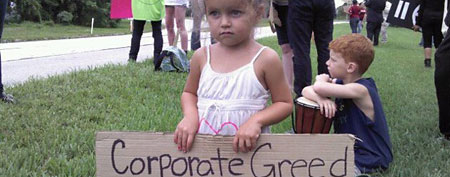 Child holds sign in Iowa. (Photo courtesy of Shauna Jackson)
