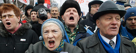 Demonstrators shout during a mass rally to protest against alleged vote rigging in Russia's parliamentary elections in Moscow, Russia, Saturday, Dec. 10, 2011. Russians angered by allegedly fraudulent parliamentary elections are protesting Saturday in cities from the freezing Pacific Coast to the southwest of Russia, eight time zones away, a striking show of indignation, challenging Prime Minister Vladimir Putin's hold on power. (AP Photo/Mikhail Metzel)