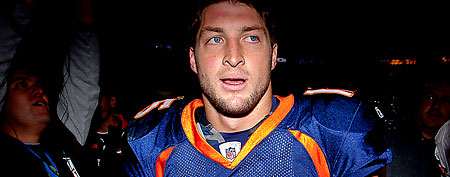 Quarterback Tim Tebow #15 of the Denver Broncos walks off the field after winning in overtime against the Chicago Bears at Sports Authority Field at Mile High on December 11, 2011 in Denver, Colorado. The Broncos defeated the Bears 13-10 in overtime. (Photo by Justin Edmonds/Getty Images)