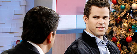 In this image released by ABC, NBA basketball player Kris Humphries listens to co-host Josh Elliot during an interview, Friday, Dec. 9, 2011, on "Good Morning America," in New York. Humphries and his mother later baked holiday cookies during a cooking segment. (AP Photo/ABC, Lou Rocco)
