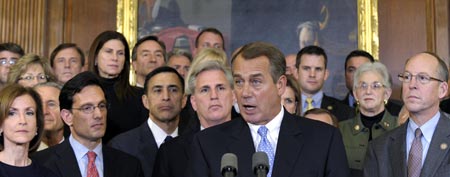 House Speaker John Boehner of Ohio, surrounded by Republican House members, speaks during a news conference on Capitol Hill in Washington on Dec. 20, 2011. (AP Photo/Susan Walsh)