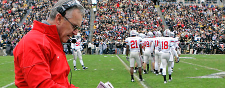 In this Oct. 17, 2009, file photo, former Ohio State head coach Jim Tressel walks the sidelines during the fourth quarter of an NCAA college football game against Purdue in West Lafayette, Ind. (AP Photo/Darron Cummings, File)