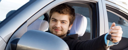 Young man driving a car (Thinkstock)
