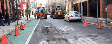 A misspelled school crossing sign is torn out of the pavement, Tuesday, Jan. 24 2012 on the Lower East Side neighborhood of New York. (AP Photo/Mary Altaffer)
