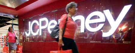 Customers leave the J.C. Penney store in the Manhattan Mall with their purchases on Friday, July 31, 2009, in New York. (AP Photo/Mary Altaffer)