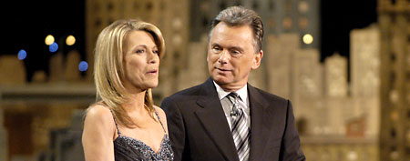 Wheel of Fortune hosts Vanna White (L) and Pat Sajak address the audience while taping episodes of the game show at Navy Pier on March 7, 2008 in Chicago, Illinois. Photo Paul Warner / Contributor