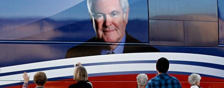 Supporters of Republican presidential candidate, former Speaker of the House Newt Gingrich (R-GA) wave goodbye to his campaign bus after he addressed the Orange County Liberty Counsel Forum at Aloma Baptist Church January 28, 2012 in Winter Park, Florida. (Photo by Chip Somodevilla/Getty Images)