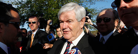 Newt Gingrich speaks with members of the media during a campaign stop outside a polling place at the First Baptist Church of Windermere. (AP/Matt Rourke)