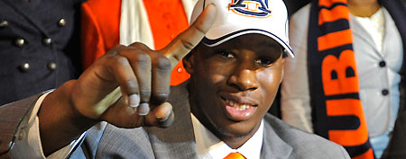 Woodlawn's Cassanova McKinzy gestures moments after signing with Auburn on national signing day during a news conference, Wednesday, Feb. 1, 2012, in Birmingham Ala. (AP Photo/The Birmingham News, Bernard Troncale)