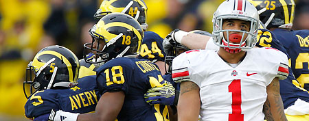 Courtney Avery #5 of the Michigan Wolverines celebrates a late fourth quarter interception in front of Dan Herron #1 of the Ohio State Buckeyes at Michigan Stadium on November 26, 2011 in Ann Arbor, Michigan. (Photo by Gregory Shamus/Getty Images)