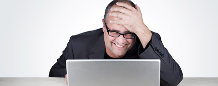 Wall Street employee reacting to email (Thinkstock)